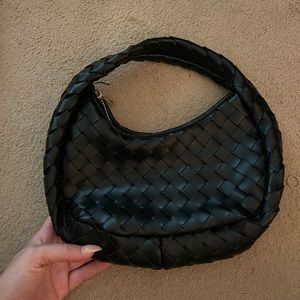 Anthropologie black bag (slight tear shown in second picture)